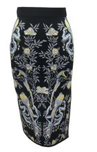 Anna Bird Jacquard Skirt in Black - VIAVAI FASHION  Photograph of a pencil skirt in black color with a bird , floral, and fruit pattern  in grey, yellow, blue and purple colors. photo of the front view .